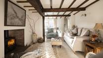 Cuddle up on the gorgeous sofa and chairs in front of the crackling wood-burner at the Old Farmhouse. 