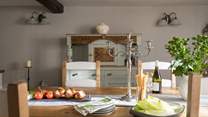 Individual vintage furniture graces the dining-room. 