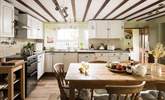 Enjoy fantastic meals around the farmhouse kitchen table. - Thumbnail Image