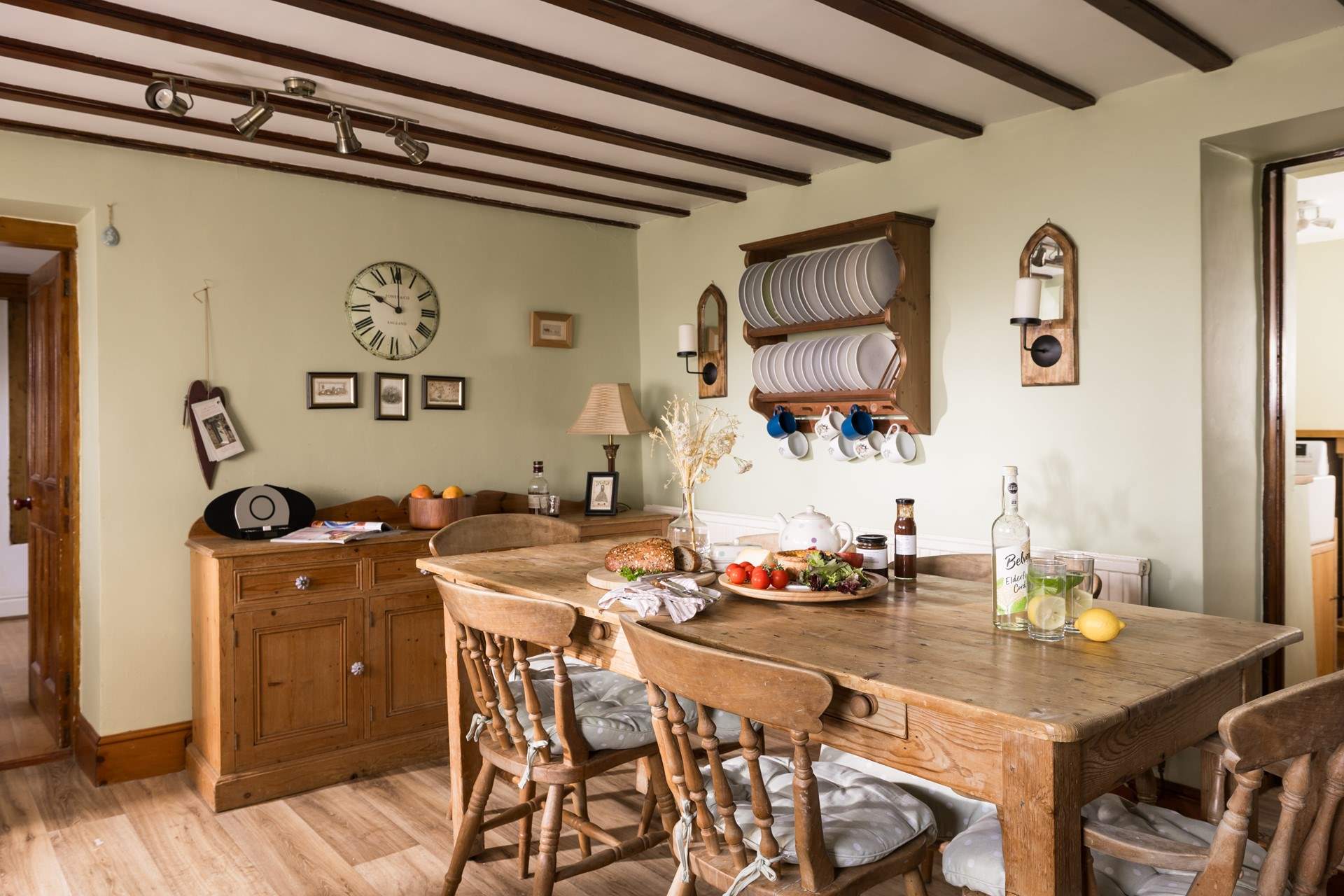 Admire the rustic plate rack and the traditional furniture.