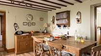 Admire the rustic plate rack and the traditional furniture.