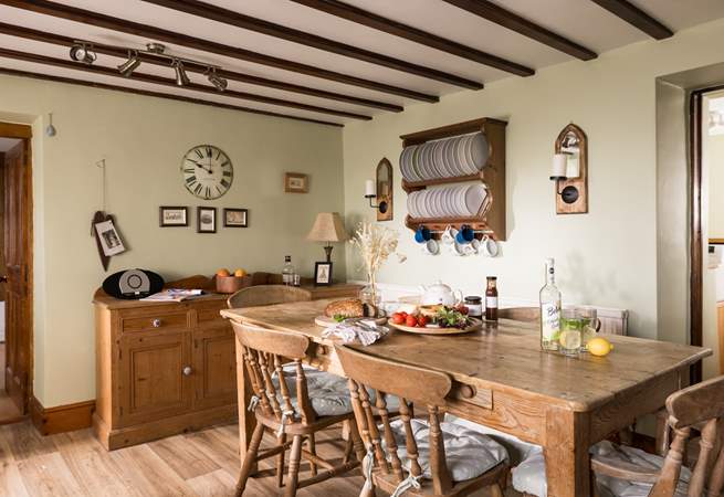 Admire the rustic plate rack and the traditional furniture.