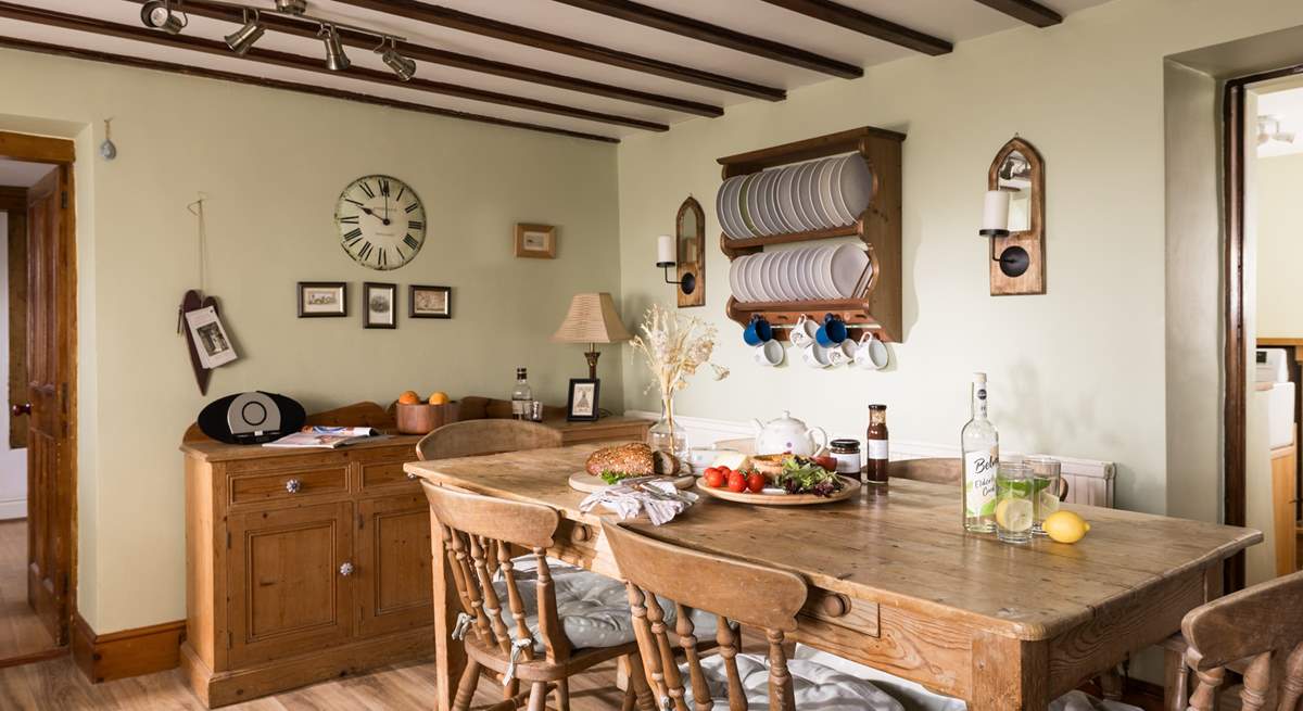 Admire the rustic plate rack and the traditional furniture.