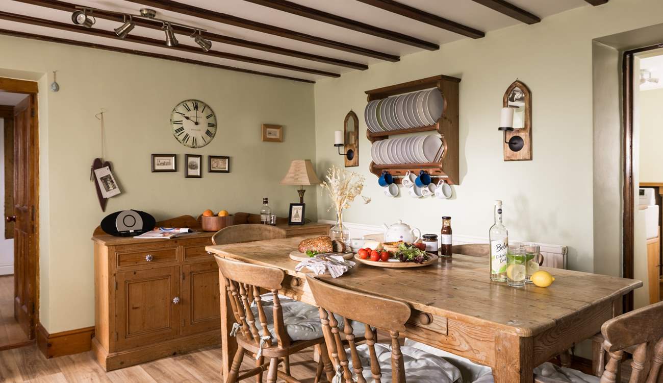 Admire the rustic plate rack and the traditional furniture.