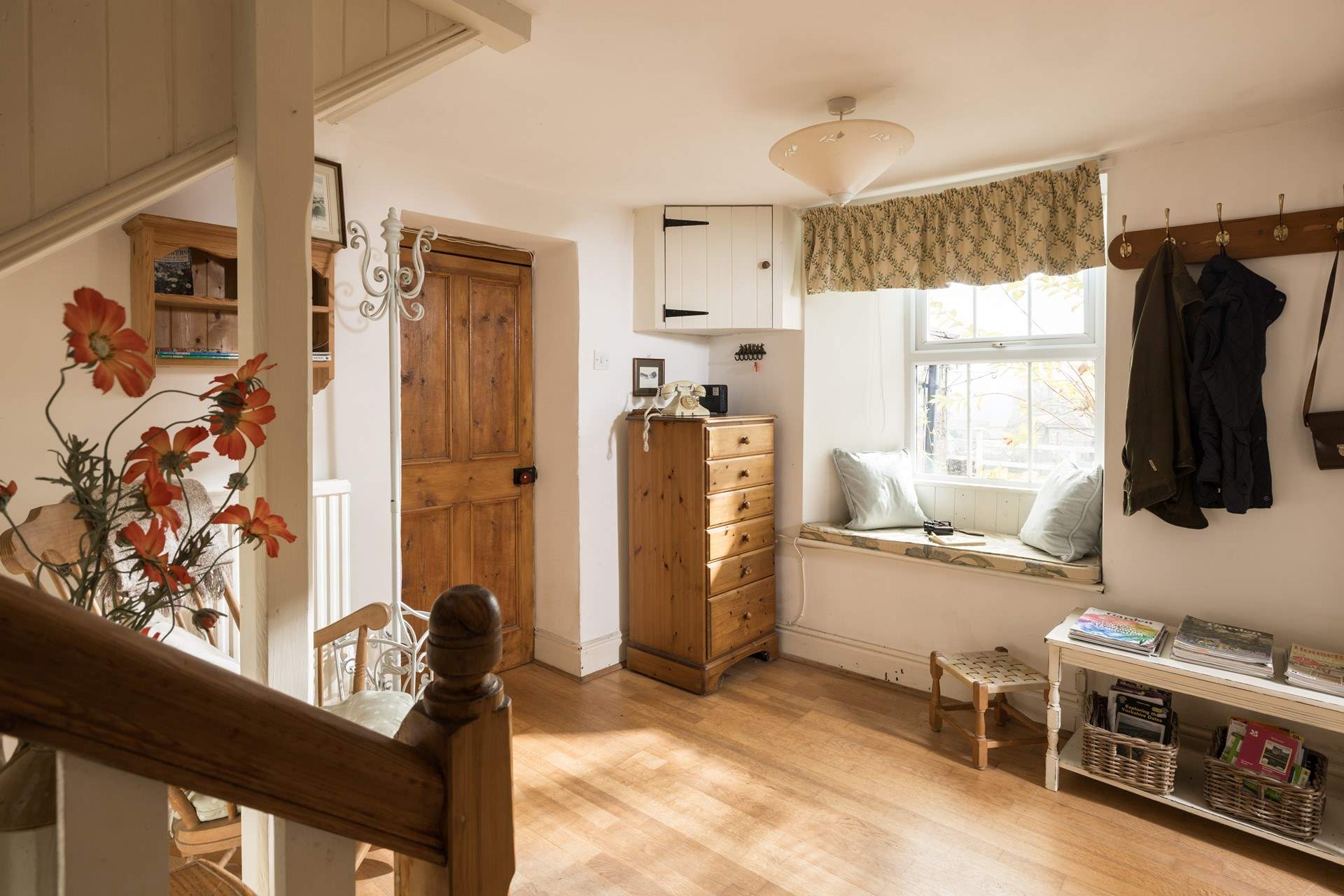 A comfy nook to rest and admire the view through the window.