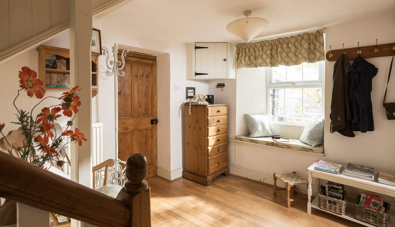 A comfy nook to rest and admire the view through the window.