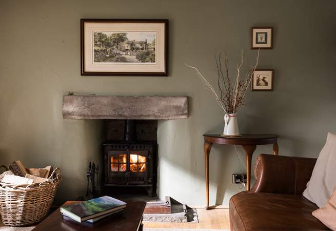 Cosy up in front of the wood-burner and relax (February 2026: Please note the wood-burner pictured here has recently been replaced with a slightly newer model). 