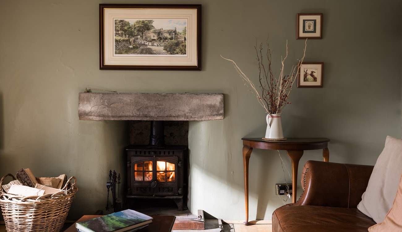 Cosy up in front of the wood-burner and relax (February 2026: Please note the wood-burner pictured here has recently been replaced with a slightly newer model). 