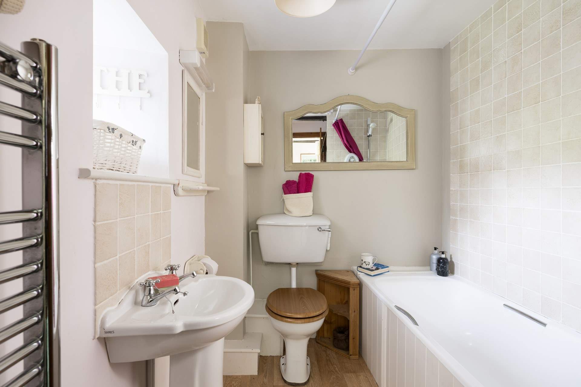 The second bathroom has a shower over the bath.