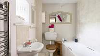 The second bathroom has a shower over the bath.