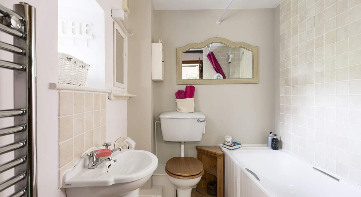 The second bathroom has a shower over the bath.