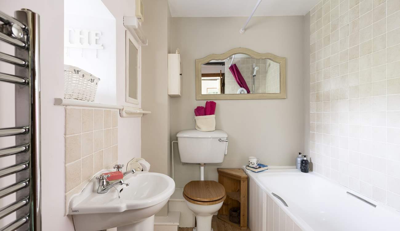 The second bathroom has a shower over the bath.