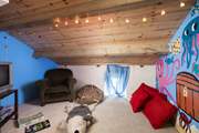 ... a cosy playroom with toys and games.