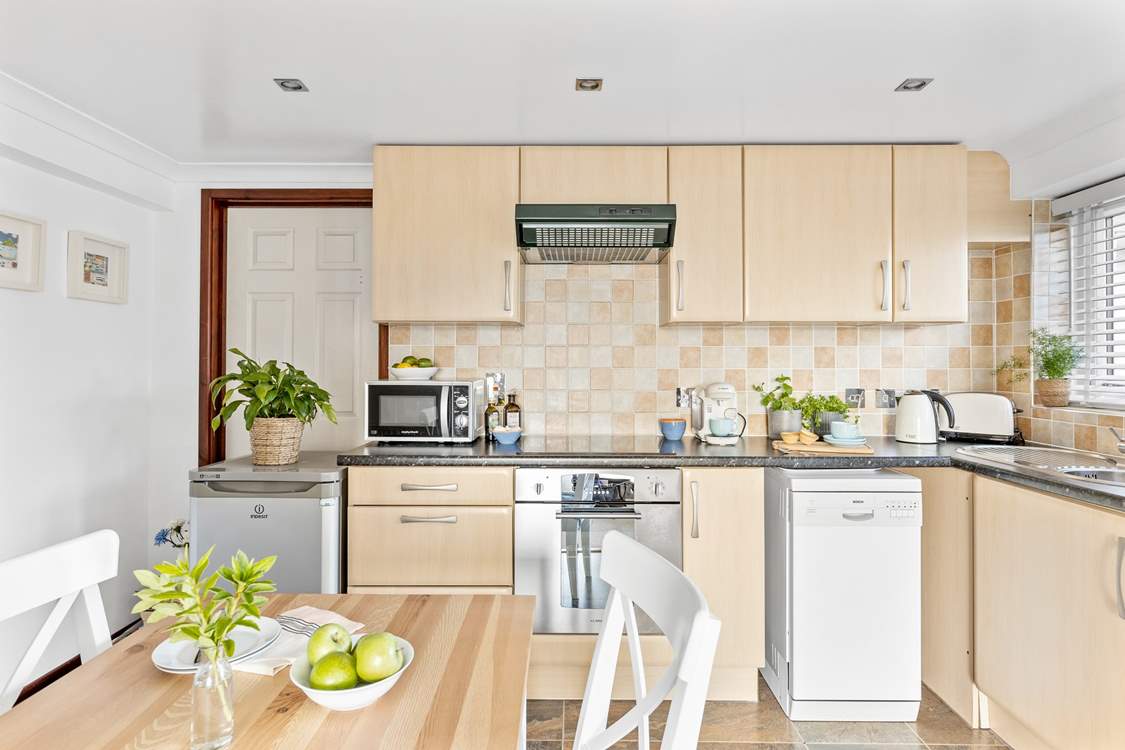 The kitchen/dining area is well-equipped, with all you need to rustle up a feast.