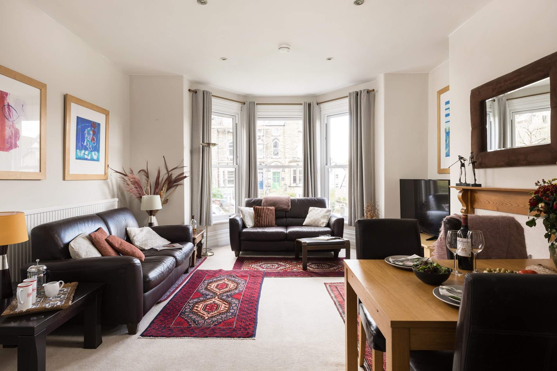 The large windows let in lots of sunlight. 