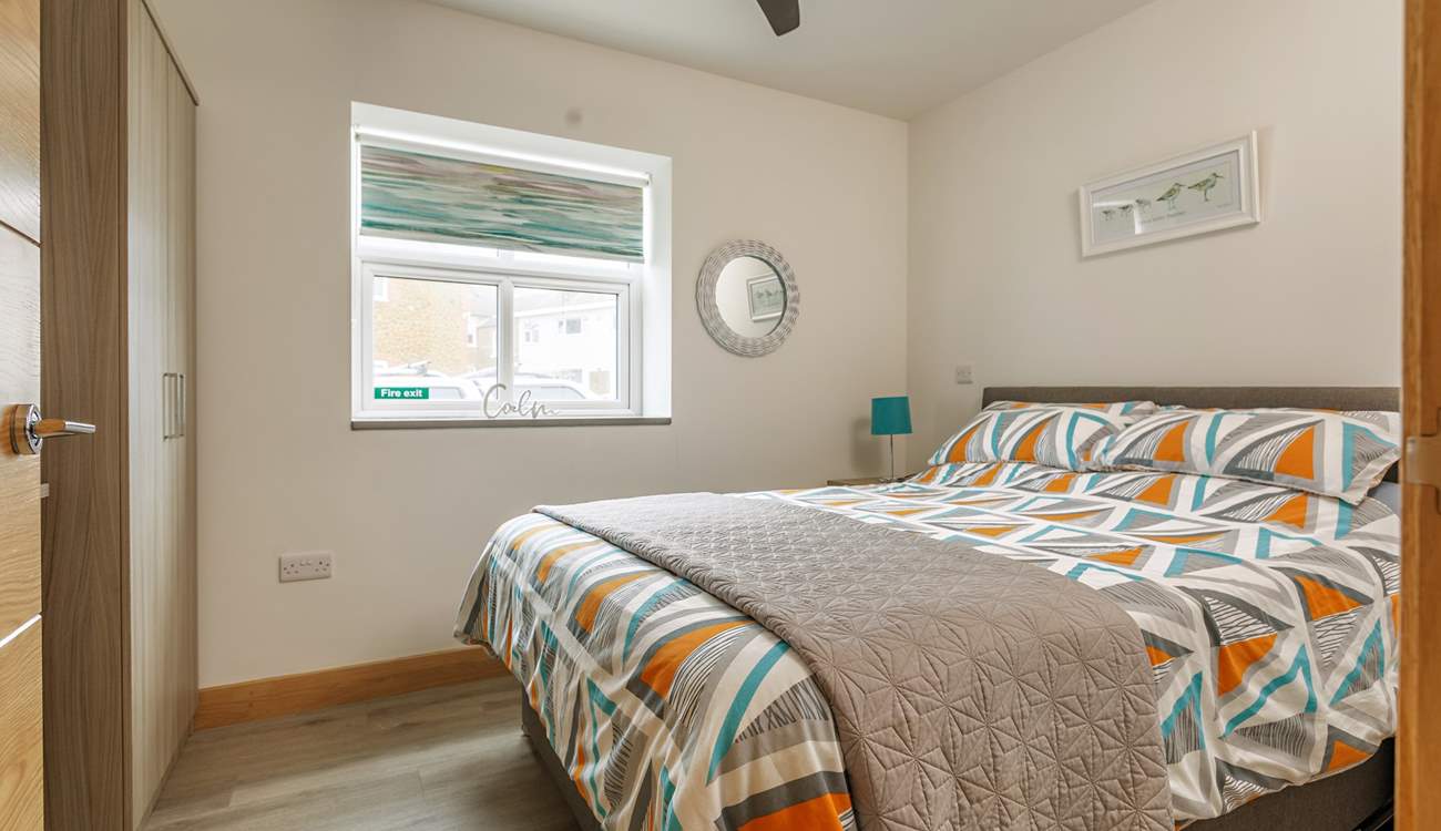 Bedroom 1 has a comfy king-size bed.