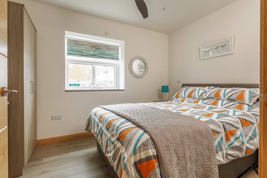 Bedroom 1 has a comfy king-size bed.