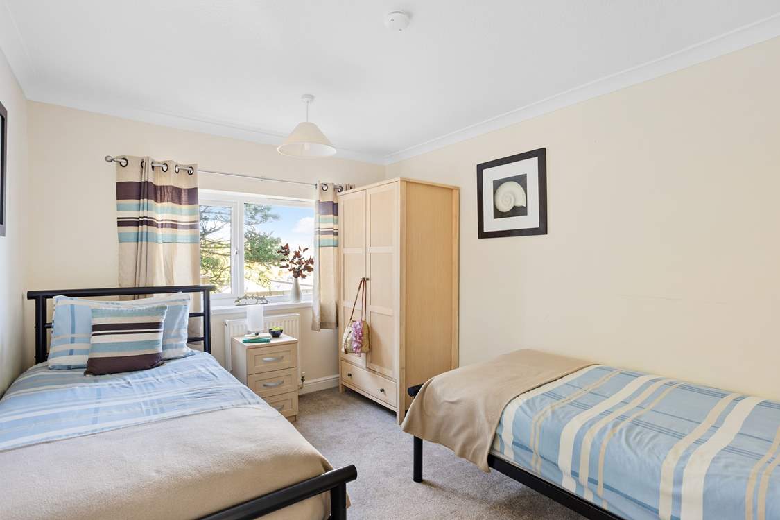 Twin beds await in bedroom 2.