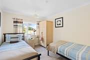 Twin beds await in bedroom 2.