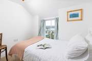Bedroom 2 is a pretty single bedded room with views towards the bay.