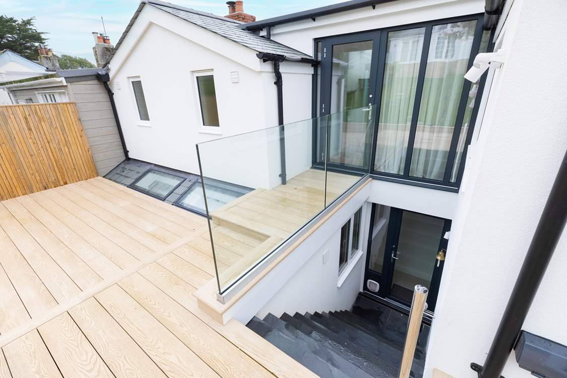 Stairs from the deck lead to the ground floor.