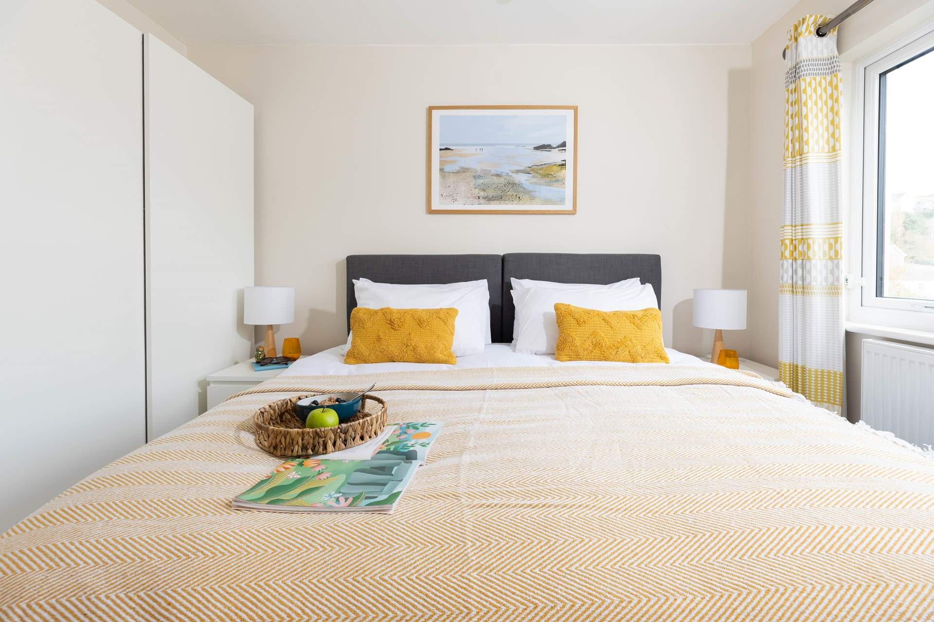 This sunny and light bedroom awaits.