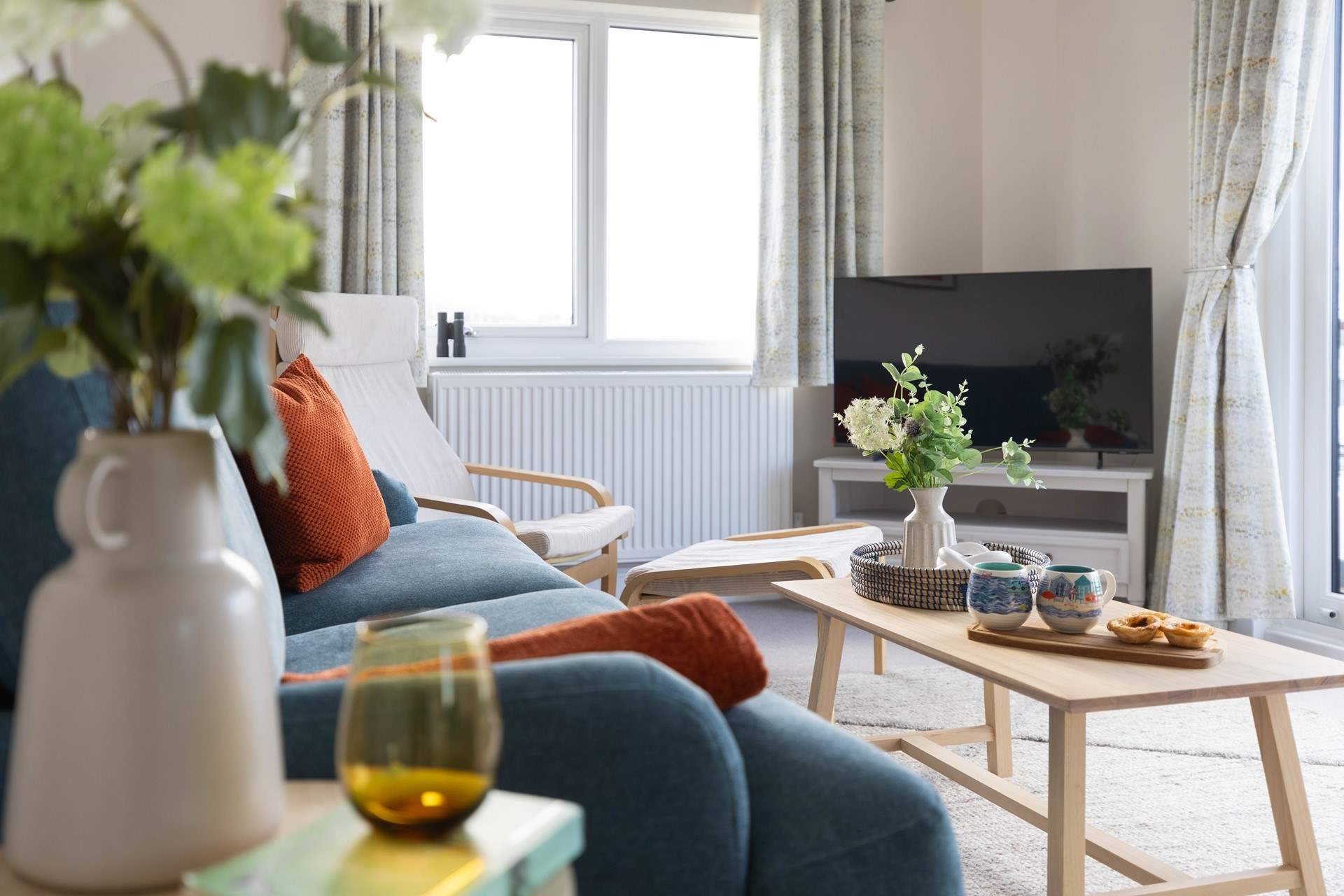 The gorgeous open plan living-room. Cosy up with a hot drink and a treat whilst enjoying the view.