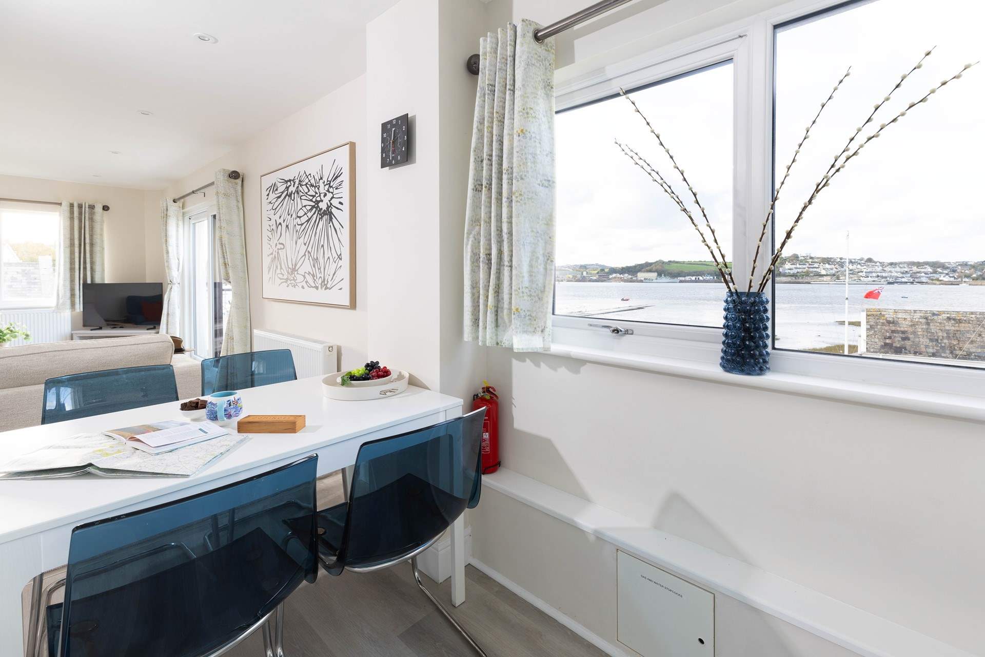 The open plan living-room sits to the front of the apartment with views over to Appledore, you can even catch the seasonal ferry across.