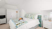 Bedroom 4 is super inviting and also boasts a TV for extra enjoyment.