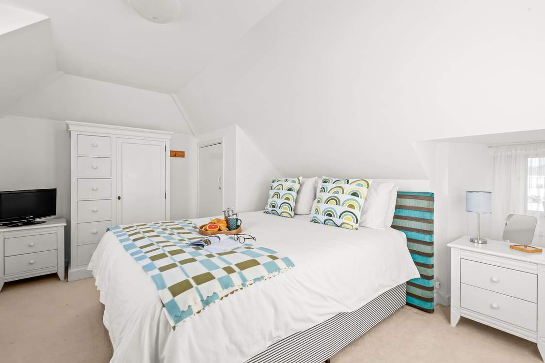 Bedroom 4 is super inviting and also boasts a TV for extra enjoyment.