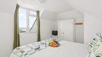Superb views can be enjoyed from this charming bedroom too.