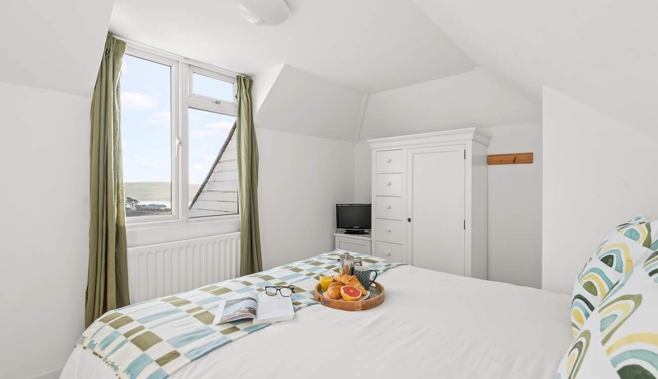 Superb views can be enjoyed from this charming bedroom too.