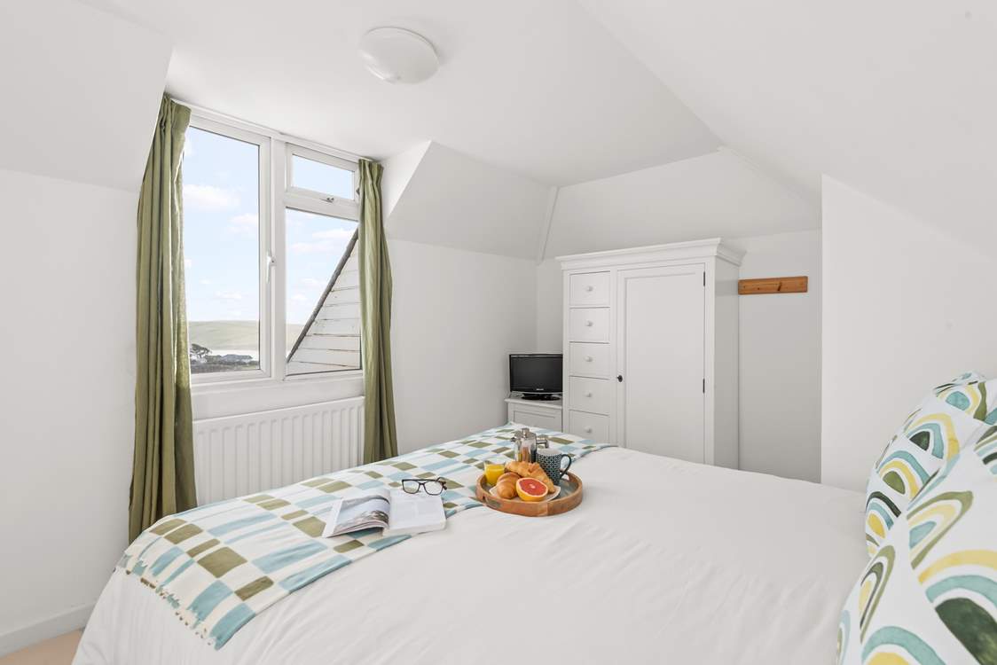 Superb views can be enjoyed from this charming bedroom too.