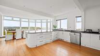 Oodles of space and work surfaces for chef to work with, not forgetting that fabulous view.