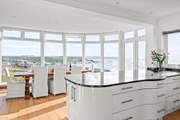 The kitchen and dining space have the most incredible views out to sea.