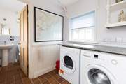 The utility-room has a washing machine and tumble-drier with access to the ground floor bathroom.