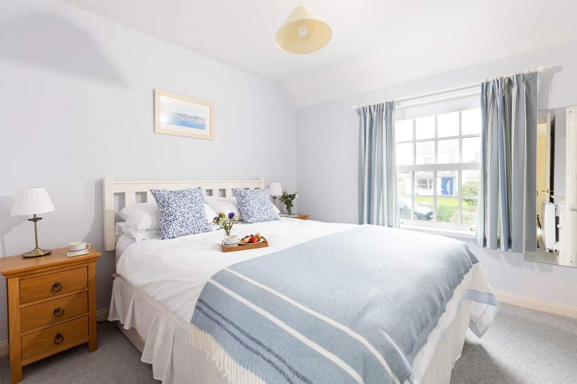 The bedrooms are decorated in seaside hues.