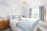 The bedrooms are decorated in seaside hues.