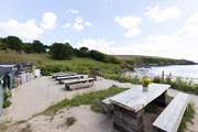 The Hidden Hut is perfectly placed overlooking Porthcurnick beach.