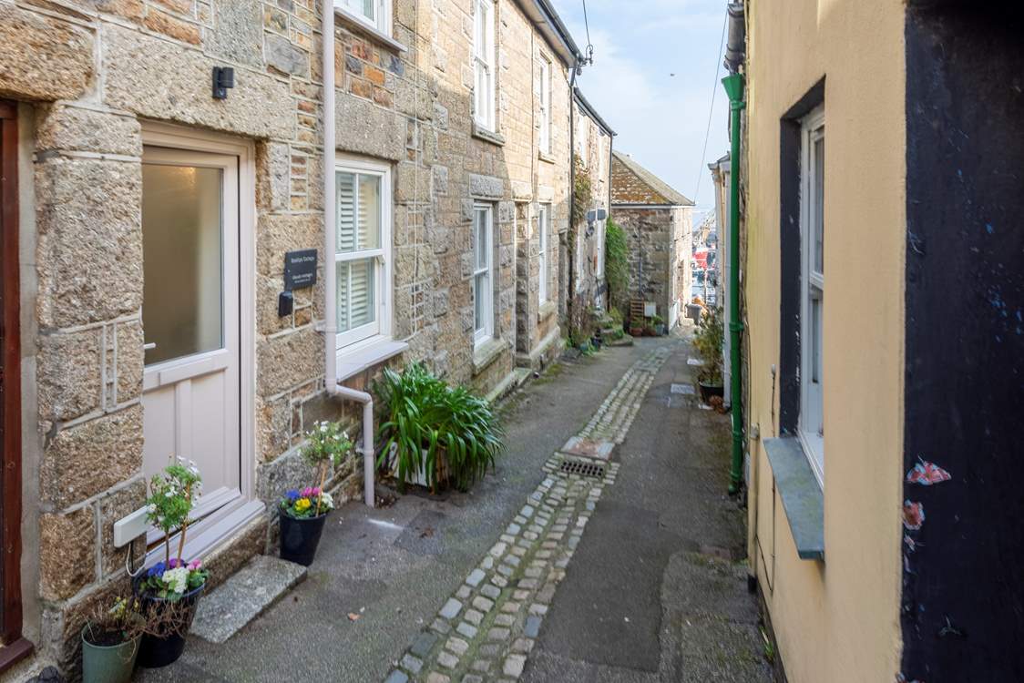 Welcome to Bodillys Cottage, a charming traditional cottage which slopes to the bustling harbour of Newlyn where fishing boats bob in the sea and gulls call overhead.