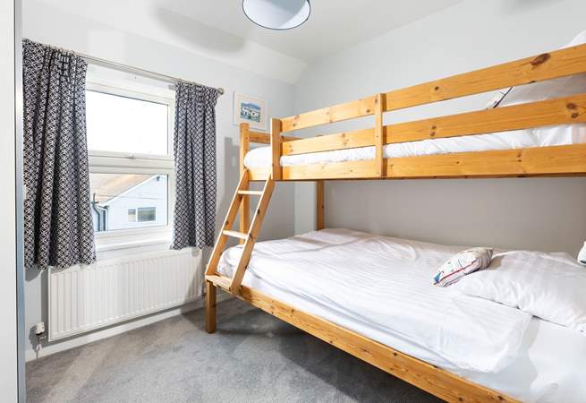 Bedroom 2 with seaside glimpses. 