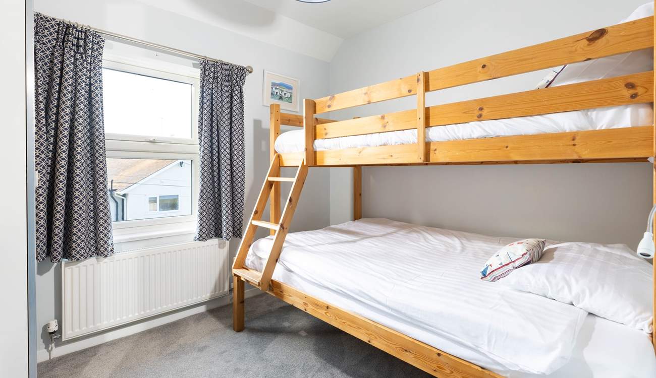 Bedroom 2 with seaside glimpses. 