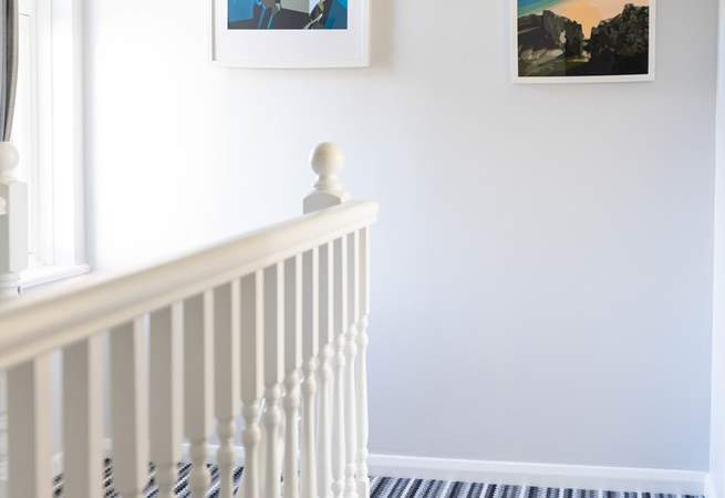 Colourful seaside art throughout the house. 