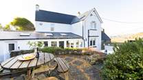 Soak up the sea air and the beauty of your surroundings from spellbinding Newgale Beach Cottage. The blissful hot tub awaits. 