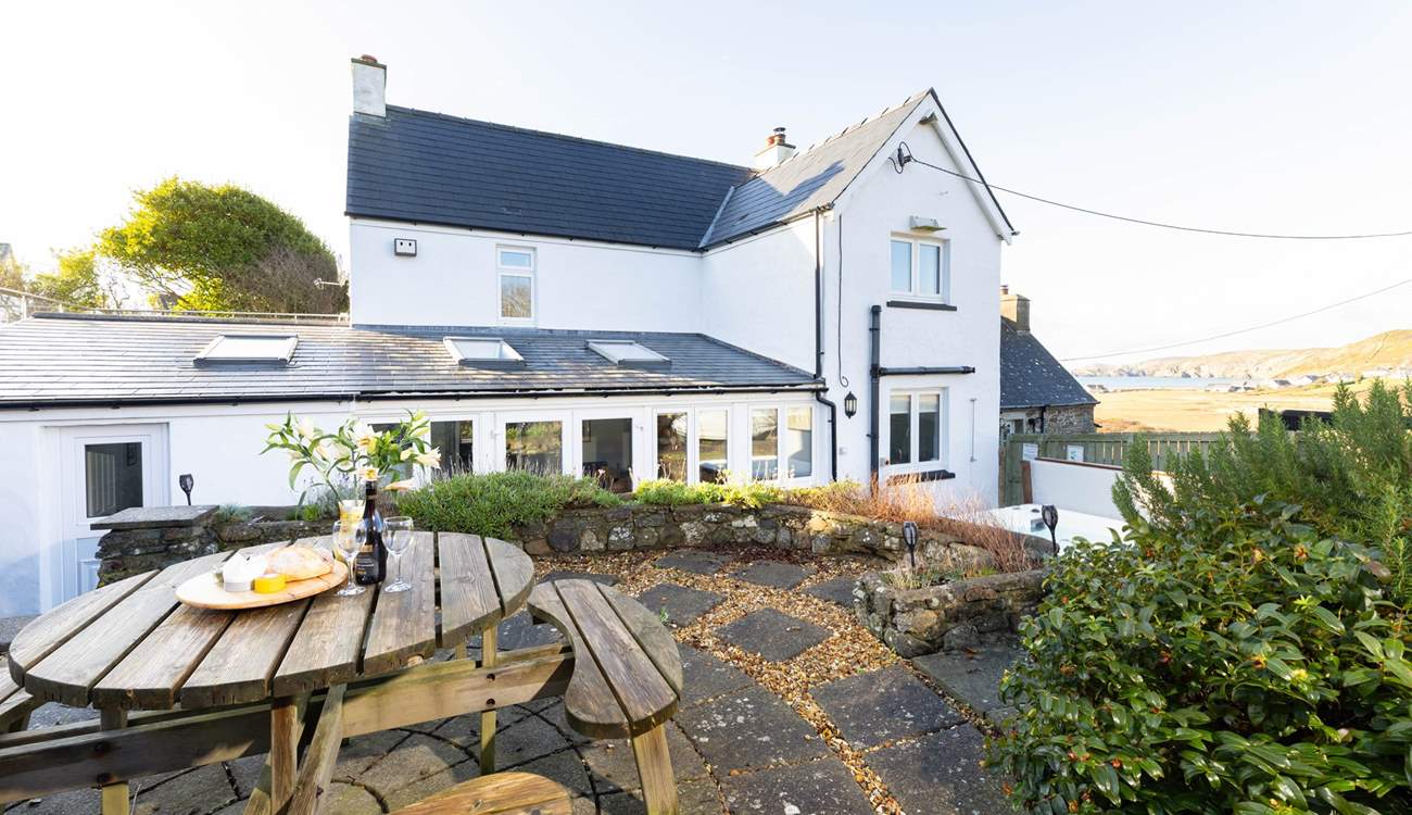 Soak up the sea air and the beauty of your surroundings from spellbinding Newgale Beach Cottage. The blissful hot tub awaits. 