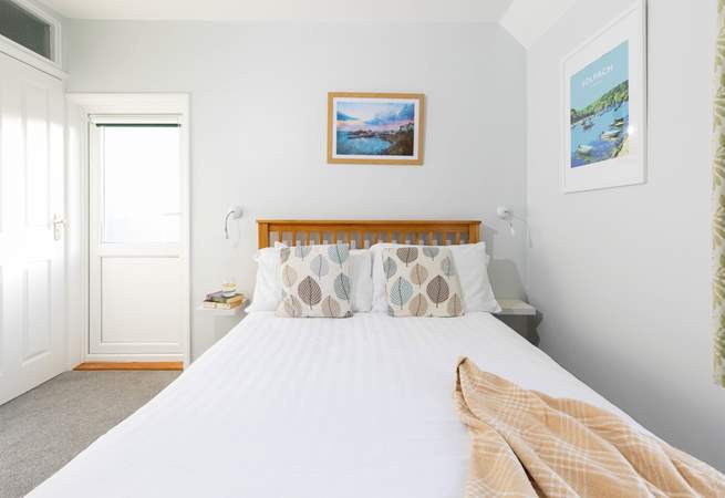 Bedroom 1, a double with en suite shower-room and access to the balcony, has steps leading to the rear terraces. 