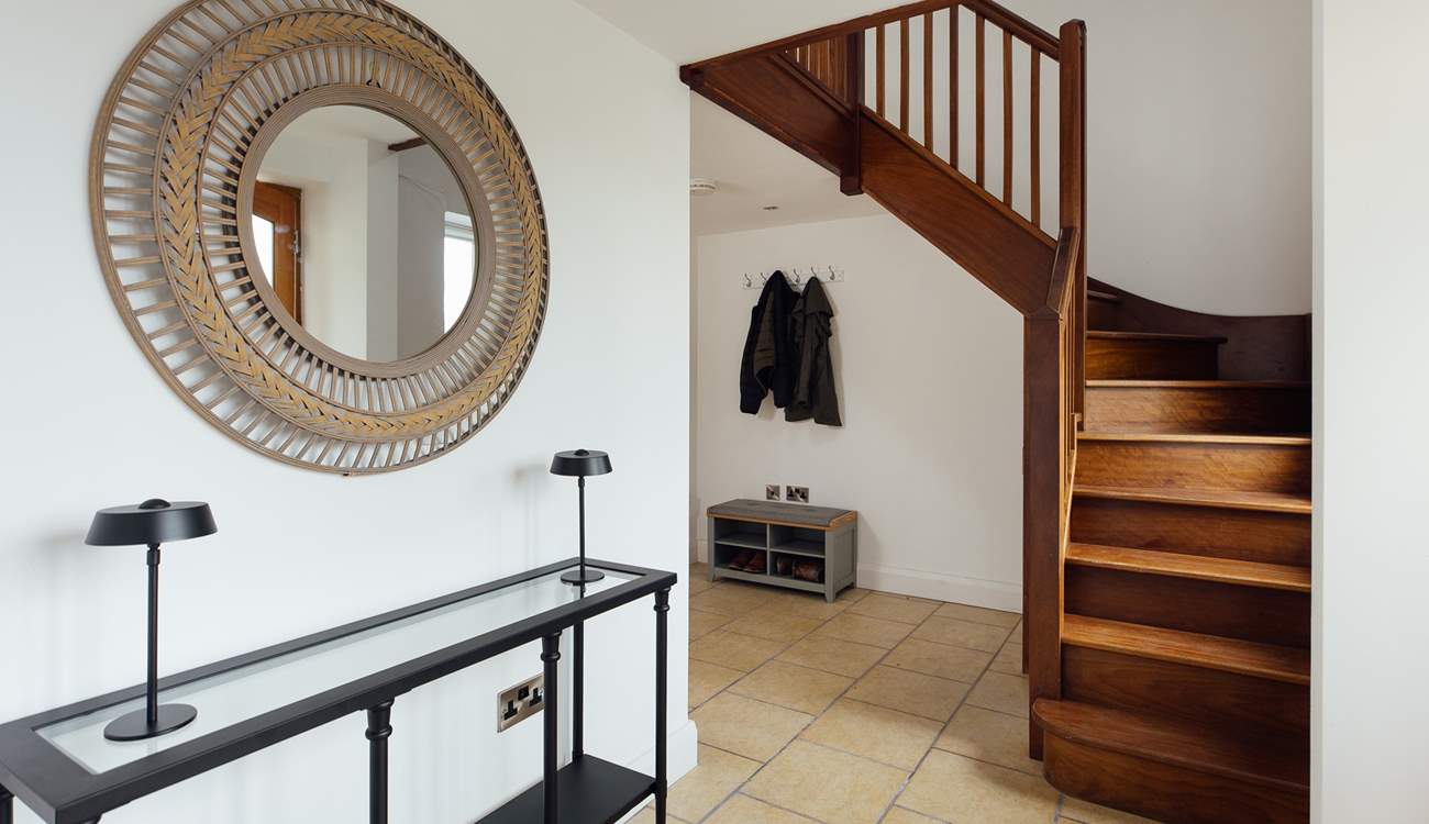 Useful utility cupboard and boot-room area off the hallway. 