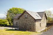 A stylish barn conversion set in an elevated idyllic location. Walkers will be in heaven here. Just a ten minute drive to the bustling seaside town of Aberystwyth and spectacular Cardiganshire beaches. Ysgubor offers something for everyone.