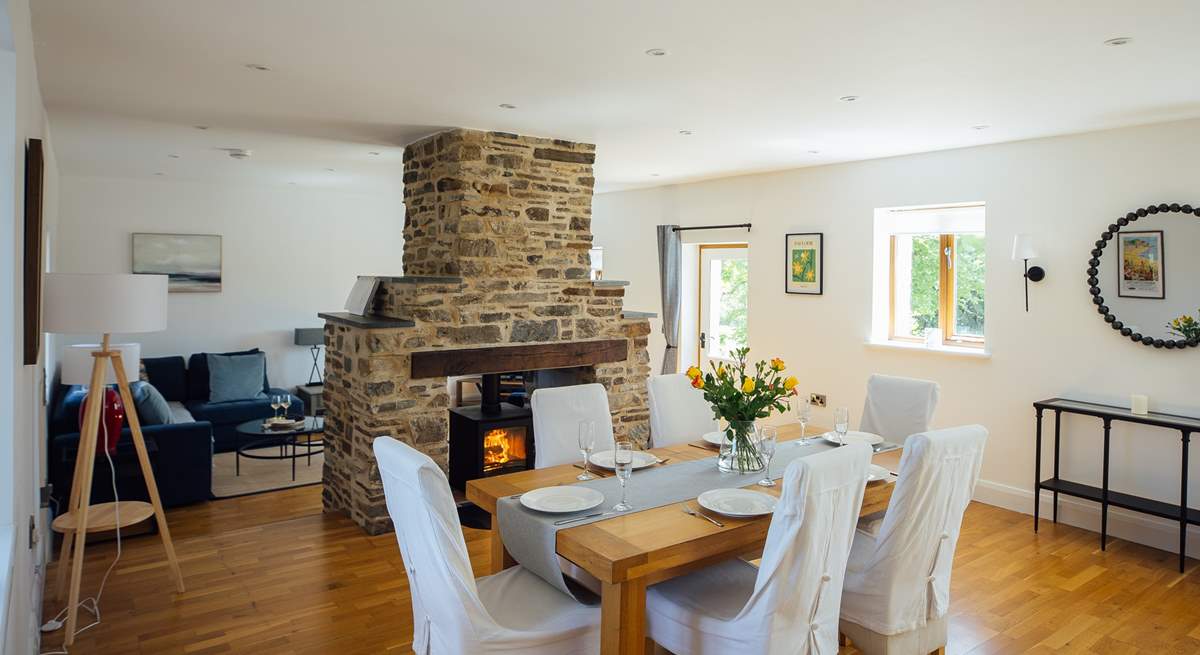 Ideal for socialising, the spacious open plan design with double sided wood burner. 