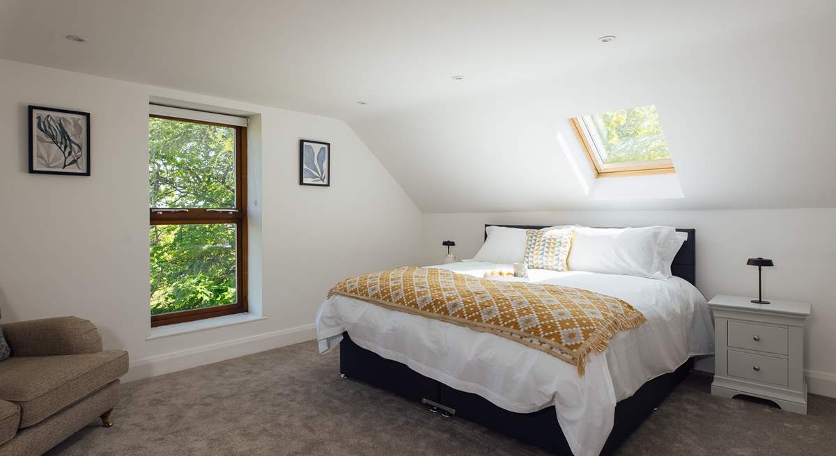  The enchanting principal bedroom with far reaching views and comfortable sofa The bed can be set up as a king or twins, please let us know when booking.